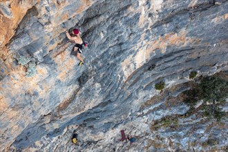 Climber climbing on a rock face