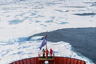Tourists watching the ice breaking on board of an icebreaker