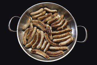 Nuremberg sausages in a frying pan