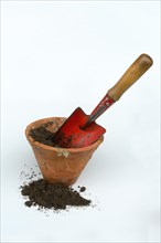 Clay pots and garden shovel