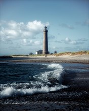 Wave and North Sea with Skagen Fyr Lighthouse