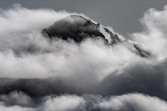 Cloudy craggy mountain