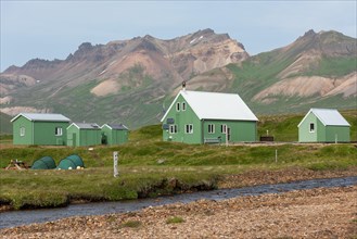 Cabins of the Icelandic Hiking Association and coloured rhyolite mountains