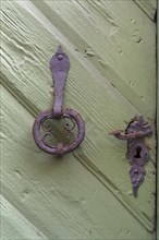 Old door knocker and door handle around 1520