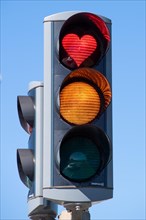Traffic light with red heart