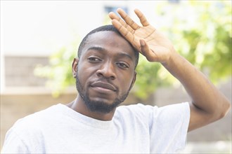 Young black man after fitness in the summer of the city