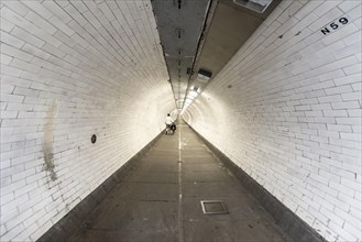 Pedestrian tunnel with white tiles
