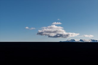 Clouds over lava desert