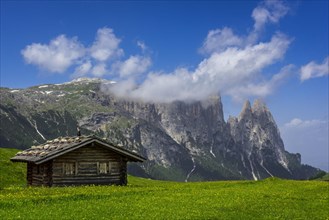 Alpine huts in front of the Schlern massif
