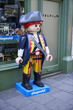 Playmobil pirate in front of toy shop
