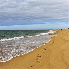 Footprints at the empty beach