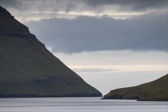 Mountain slopes dropping steeply into the sea