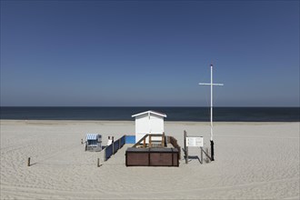 Deserted beach with lifeguard hut