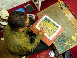 Artist creates traditional miniature painting