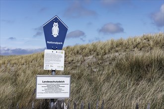 Sign National Park with pictogram Owl in the Schleswig-Holstein Wadden Sea National Park