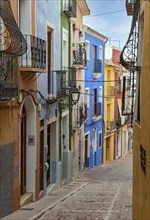 Narrow street with colorful houses in seaside town of Villajoyosa