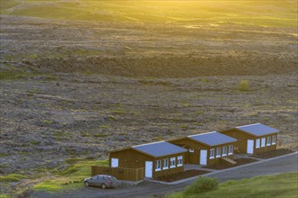 Cabins at the edge of the lava field