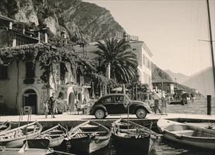 Lake Garda in 1960: VW Beetles and fishing boats in the harbour of Limone sul Garda