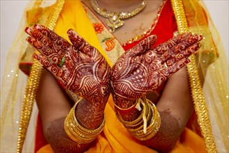 Hindu Bride's hand painted with mehndi on her wedding eve