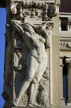 Reliefs of naked woman on the Palazzi degli Ambasciatori Embassy palaces with archway to the Quartiere Coppede