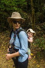 Womna hiking with her baby through the Unesco world heritage site