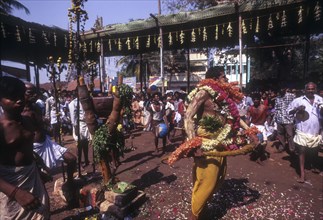 A god possessed man beating himself with whip. Mariamman festival at Coimbatore