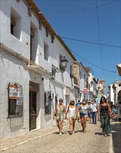 Group of tourists in narrow streets of Altea Old Town