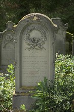 Gravestone with wreath at the historic Jewish cemetery