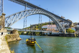 Beautiful iron Dom Luis I bridge over Douro river in Porto