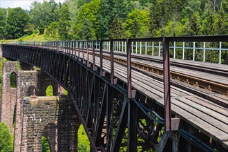 Old stone railway viaduct in the mountains
