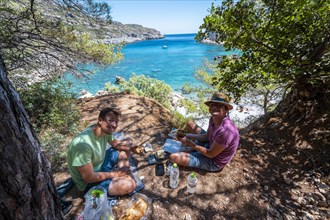 Two young men having a picnic