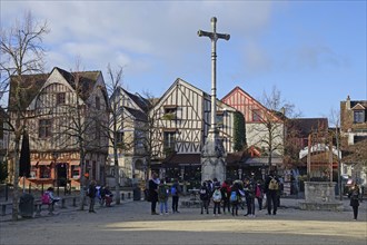 Place du Chatel with cross and half-timbered houses