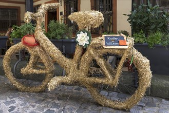 Bicycle wrapped in straw