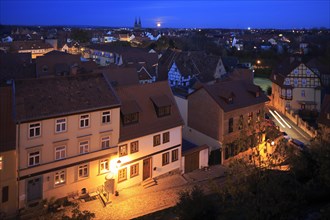 View of Quedlinburg from the Schlossberg in the evening with moonrise