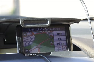 Garmin navigation device in a car driving on the Via Appia Antica