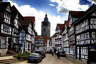 Street with half-timbered houses and church tower