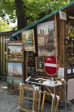 Sales stand with oil paintings and picture frames