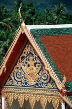 Hand-carved relief on gable of Buddhist temple