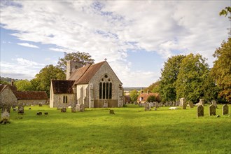 Old British church made of stone located in rural area in the south of England