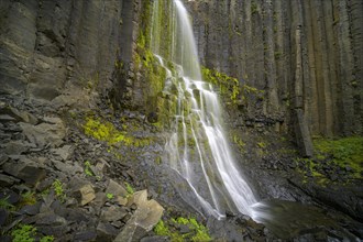 Waterfall framed by basalt columns