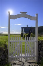 Wooden gate at the historic peat homestead Keldur