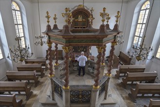 Central bima with octagonal stone parapet in the synagogue from 1746