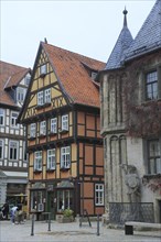 Half-timbered house and town hall with Roland statue