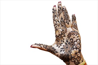 Hand of Hindu bride painted with hennas isolated on white background