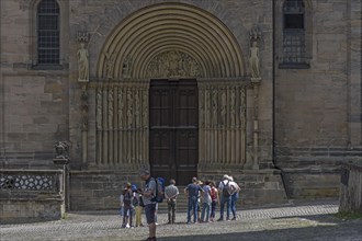 Tourists in front of the prince's portal around 1230