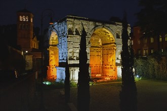 Illuminated Arch of Janus at night