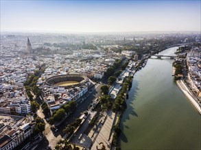 Aerial view of Seville with visible bullring and cathedral tower
