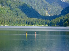 2 people on standup paddle board in Gosausee