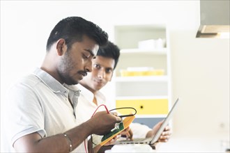 Students in an internship at the university with work equipment