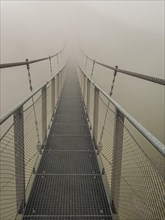 Suspension bridge in the fog